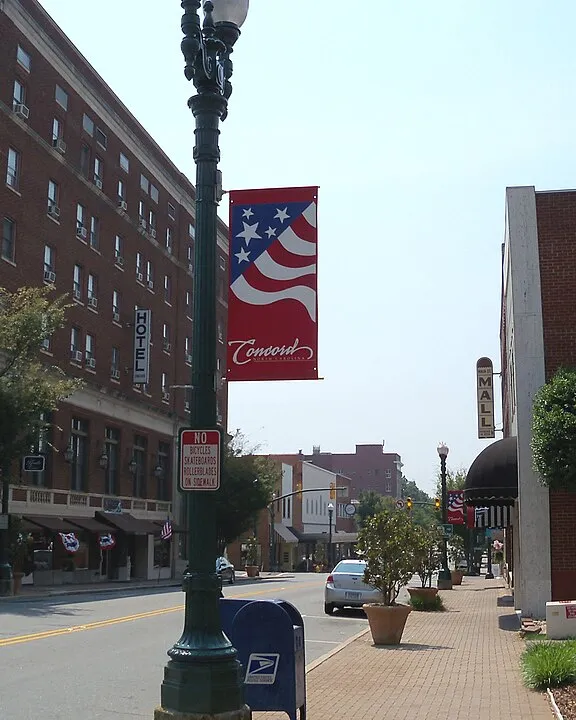 Union Street in downtown Concord, NC with a red, white and blue Concord banner